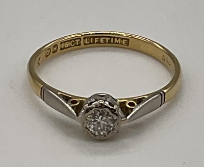 Lot 1210 - An 18ct yellow gold diamond solitaire ring in...
