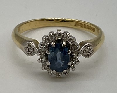 Lot 1211 - An 18ct yellow gold floral set ring with pale...