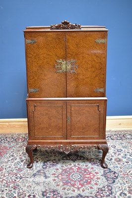 Lot 2346 - A 1950s burr walnut veneered cocktail cabinet,...