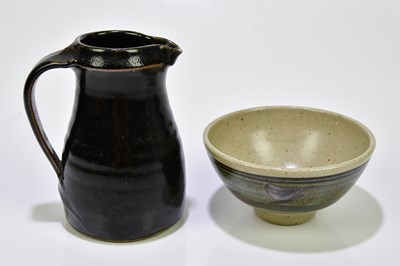 Lot 1561 - ST IVES POTTERY; a tenmoku glazed jug, height...