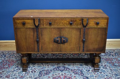 Lot 2383 - An early 20th century carved oak Art Deco...