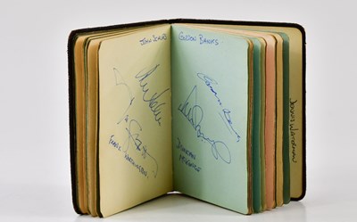 Lot 1608 - An autograph book to include Dennis Waterman,...
