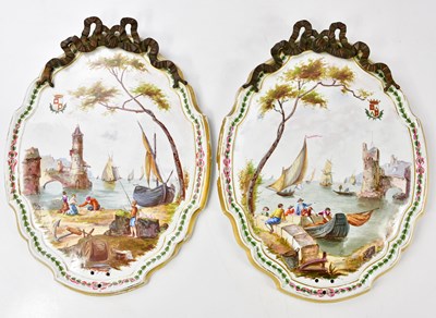 Lot 1505 - A pair of hand painted ceramic plaques, each...