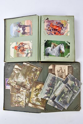 Lot 1610 - Two postcard albums containing examples...