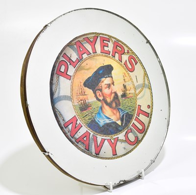 Lot 1031 - A 1930s wall mirror with later printed sticker,...
