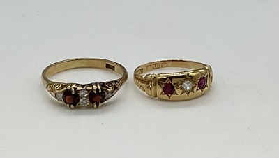 Lot 1214 - An 18ct yellow gold ruby and diamond three...