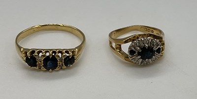 Lot 1215 - Two yellow metal sapphire and diamond rings...