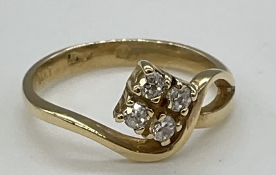 Lot 1272 - A yellow metal quatrefoil set ring stamped...