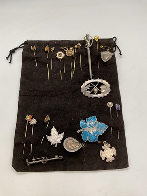 Lot 1264 - A group of stick pins, tie pins and brooches...