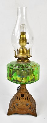 Lot 1203 - A Victorian green glass converted oil lamp,...