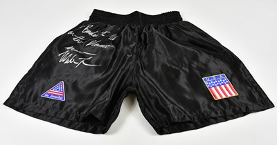 Lot 1374 - MIKE TYSON; a pair of signed shorts, signed...