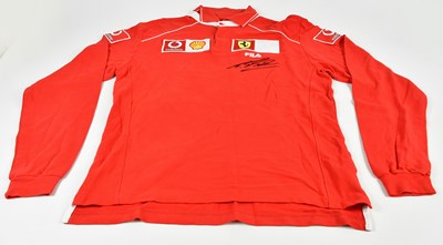 Lot 1225 - MICHAEL SCHUMACHER; a signed FILA and Ferrari...
