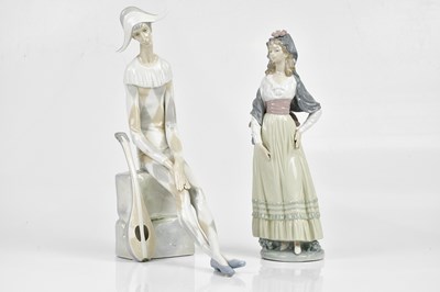 Lot 2202 - LLADRO; two figure, a jester and a maiden,...