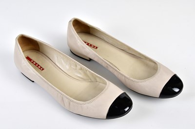 Lot 1075 - PRADA; a pair of boxed cream nappa leather...