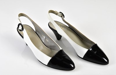 Lot 1074 - CHRISTIAN DIOR; a pair of boxed white leather...