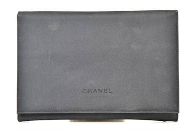 Lot 969 - CHANEL; a black nylon make-up and brush bag,...