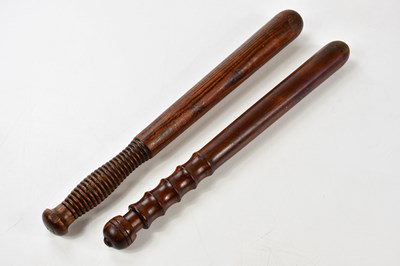 Lot 453 - Two vintage policeman's truncheons, length of...