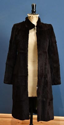 Lot 990 - EMPORIO ARMANI; a full length brown fur coat,...
