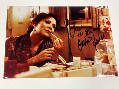 Lot 2180 - CARRIE FISHER; a sepia photograph bearing the...