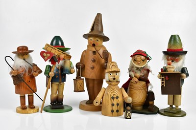 Lot 1084 - A group of modern wooden figures, height of...