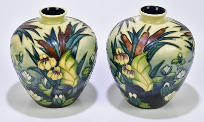 Lot 1541 - MOORCROFT; a pair of 'Bull Rush' pattern vases,...