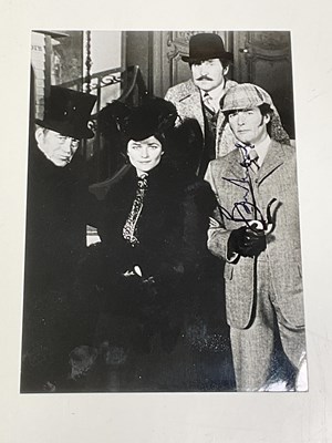 Lot 2175 - ROGER MOORE; a black and white photograph...