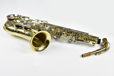 Lot 1164 - CORTON; a cased brass plated saxophone with...
