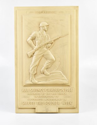 Lot 2579 - A WWII ivory coloured bakelite wall plaque,...