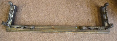 Lot 1143 - A late Victorian brass fire curb with scroll...