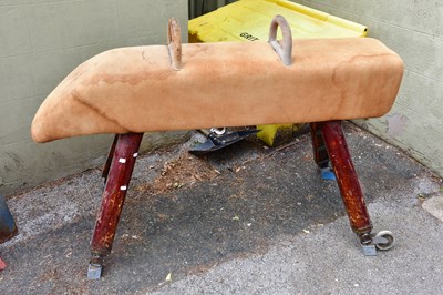 Lot 2298 - A suede topped 'pommel horse' raised on four...