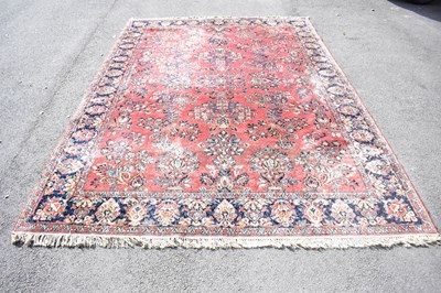 Lot 2281 - A large Eastern style carpet with floral...
