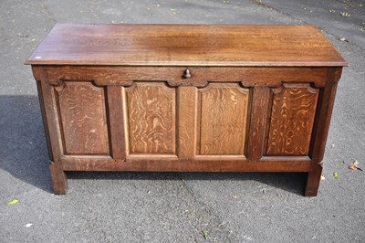 Lot 2369 - An 18th century oak coffer with panelled front...