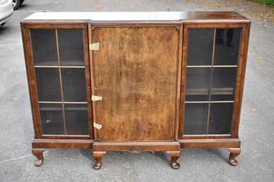 Lot 2519 - A 1930s walnut breakfront bookcase/display...