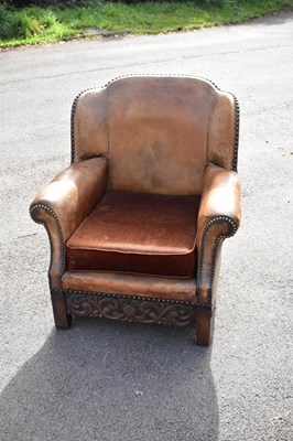 Lot 2500 - A 1920s studded leather wing back smoking...