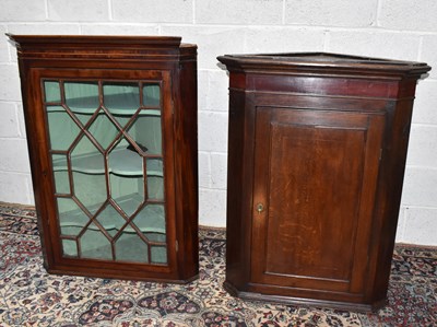 Lot 1542 - An 18th century oak hanging corner cupboard,...