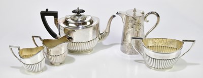Lot 1004 - WALKER & HALL; a silver plated three piece tea...