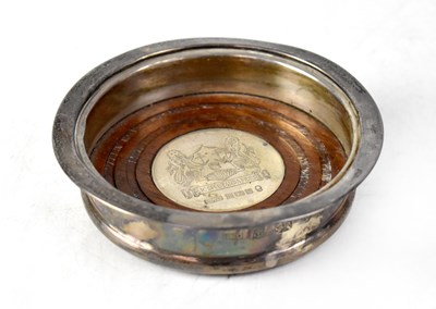 Lot 699 - An Elizabeth II hallmarked silver bottle coaster