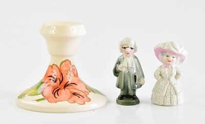 Lot 1503 - MOORCROFT; a 'Hibiscus' pattern squat candle...
