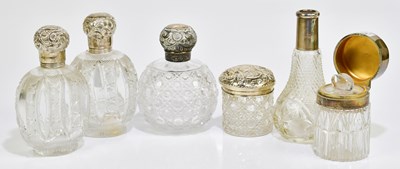 Lot 2057 - A small group of cut glass silver topped items...