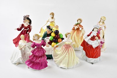 Lot 1233 - ROYAL DOULTON; a group of nine figures...