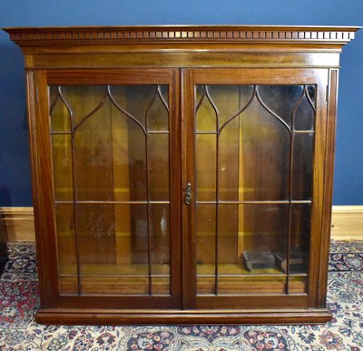 Lot 1067 - An early 20th century mahogany bookcase with...