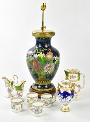 Lot 2101 - COALPORT; a blue and white gilt decorated twin...