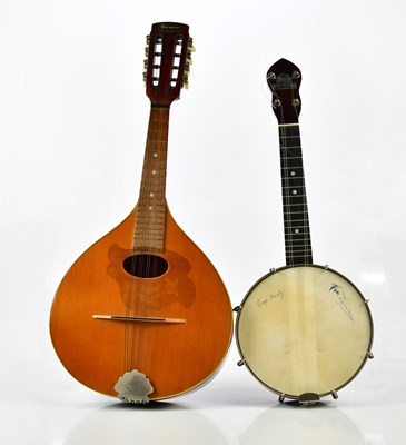 Lot 1329 - A vintage George Formby cased ukelele, with a...