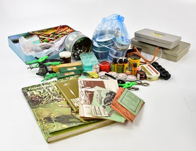 Lot 1390 - A group of fishing equipment to include spools,...