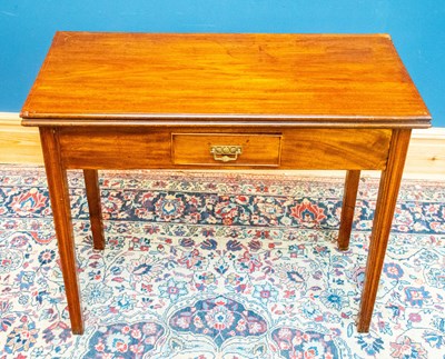 Lot 2387 - A Georgian mahogany fold over tea table with...