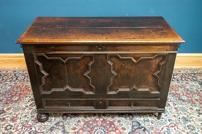 Lot 2537 - An 18th century oak coffer with panelled front...