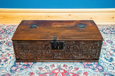 Lot 1003 - An 18th century carved oak bible box, the...