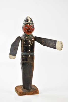 Lot 1010 - An unusual carved wooden model of a policeman,...