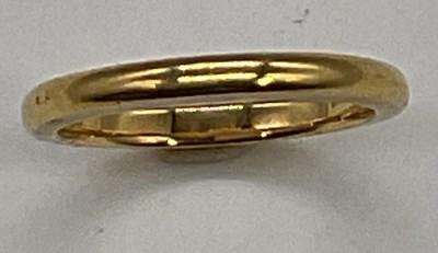 Lot 1206 - A 22ct yellow gold wedding band, size M,...