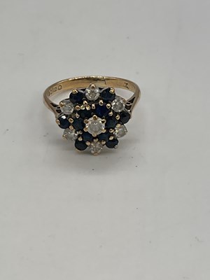 Lot 1269 - A 9ct yellow gold floral stepped dress ring,...